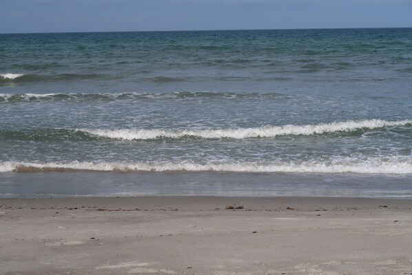 On the beach, sun-loungers