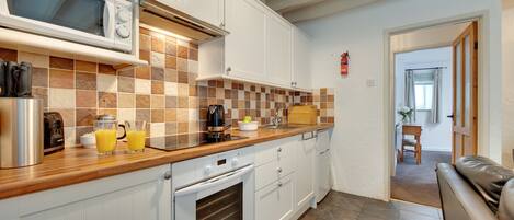 Fridge, microwave, oven, cookware/dishes/utensils