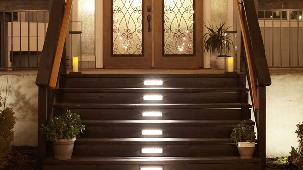 A wooden staircase leading to a door with frosted glass panels and a potted plant beside it. - Large winter retreat just minutes from Dodge Ridge and Leland Snow Park (Mi-Wuk Village)
