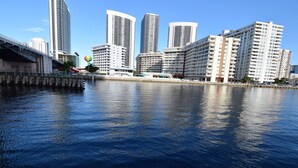 A waterfront cityscape with high-rise buildings, a bridge, and a clear sky. - Beachwalk Resort 2007b by Optimax Vacation Rentals (Hallandale Beach)