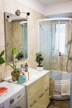 Shower, hair dryer, towels, soap