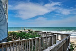 A wooden deck overlooking a beach with a view of the ocean and a clear sky. - N Topsail Beach Oceanfront Condo w/ Pool! (North Topsail Beach)