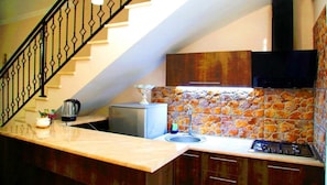 Fridge, microwave, stovetop, coffee/tea maker