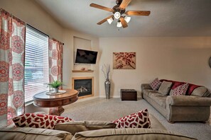 TV, fireplace, books