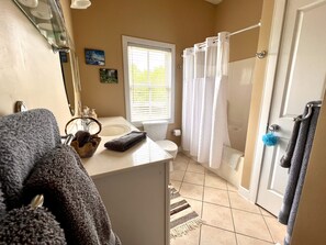 Bathtub, hair dryer, towels, soap
