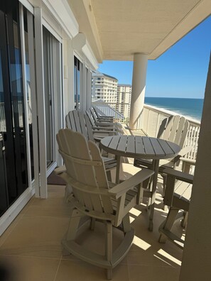 Relax on the balcony with a round table and Adirondack chairs, taking in the ocean views.