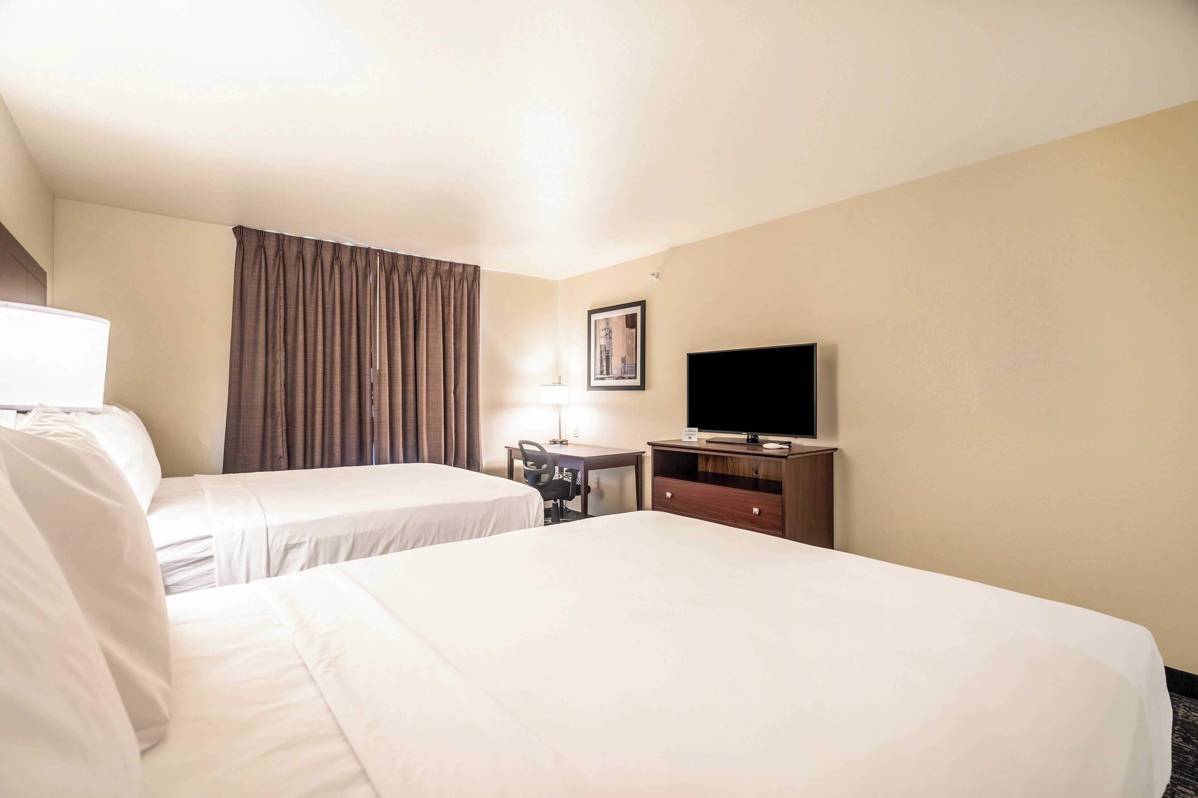 premium bedding, pillow-top beds, desk, laptop workspace