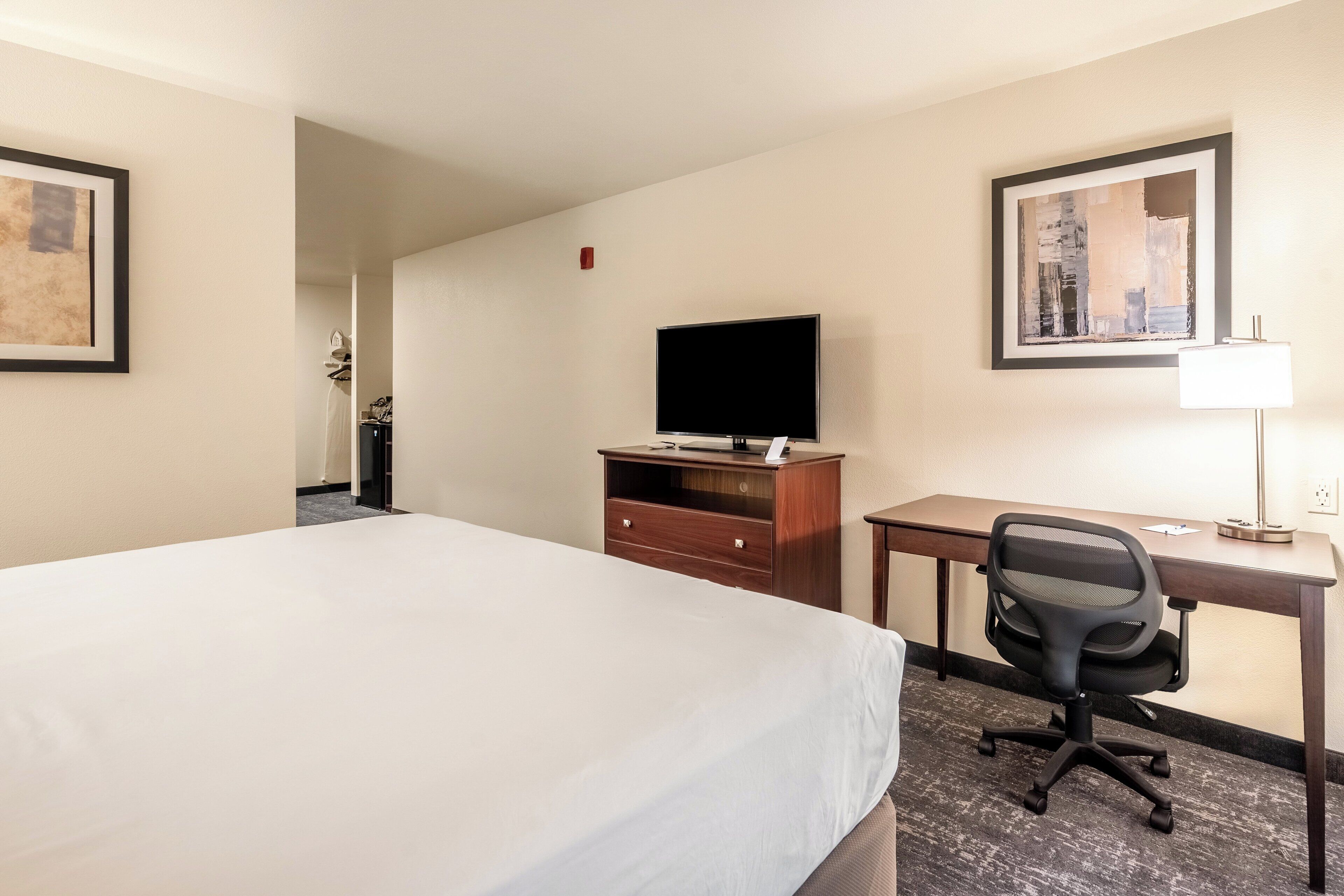 premium bedding, pillow-top beds, desk, laptop workspace