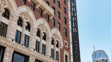 A historic building with ornate architectural details, including arched windows and decorative stonework.