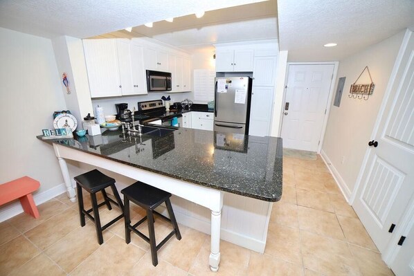 Condo, 1 King Bed, Ocean View (SEA -411 2BR Ocean View Pool Free Tix) | Private kitchen | Fridge, dishwasher, coffee/tea maker, cookware/dishes/utensils