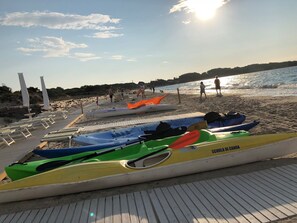 On the beach, sun-loungers, beach towels