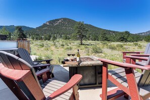 Outdoor seating with a table and chairs, a bottle of wine, and a grill. - 3 Mi to RMNP! Mtn-View Retreat in Estes Park (Estes Park)