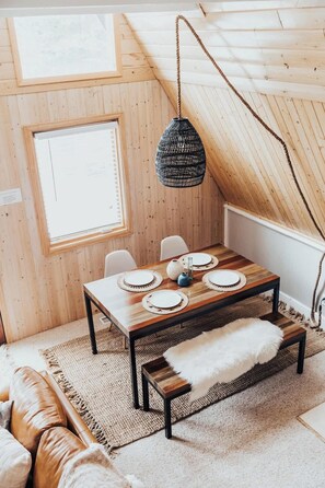 View of the dining area from the spiral staircase - The Fox A-Frame | An Intimate Mountain Retreat (Blue River)
