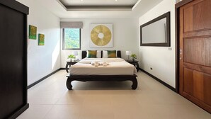 A modern bedroom with a large bed, a ceiling light, a window, and a door.