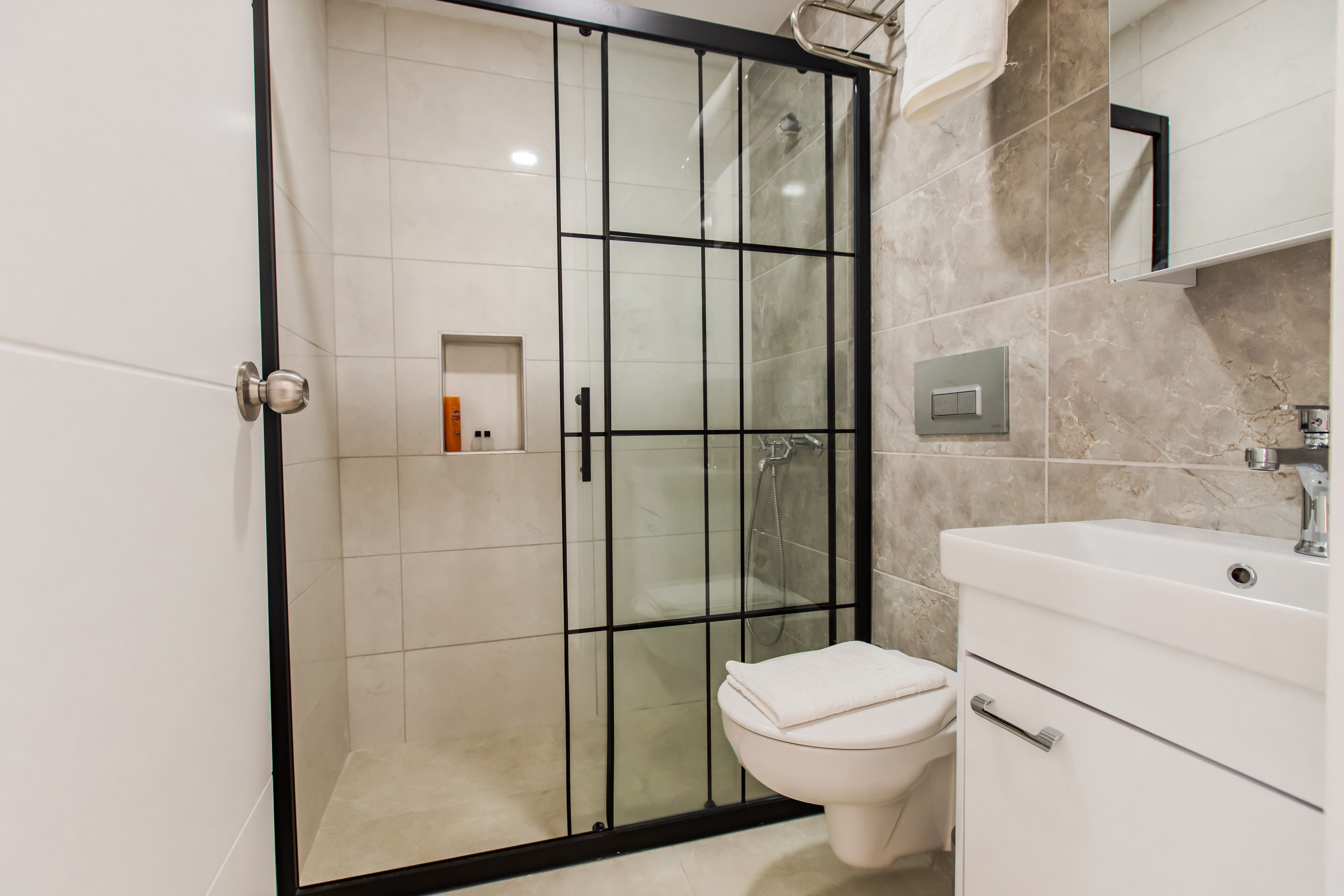 standard twin room | bathroom | shower, hair dryer, towels