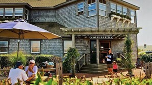 A two-story building with a sign reading "MILLIE'S" at the entrance. - Have it all! The perfect Nantucket getaway for stunning ocean views and beaches! (Nantucket)