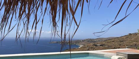 Relax by the pool with a view of the ocean.
