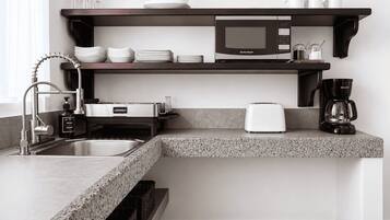 Coffee/tea maker, fridge, microwave, cookware/dishes/utensils