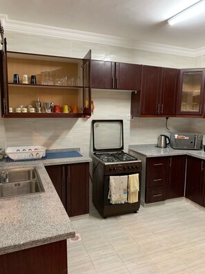 Microwave, coffee/tea maker, cookware/dishes/utensils