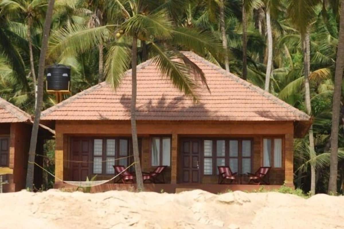 Traditionele kamer, uitzicht op strand | 1 slaapkamer, een bureau, een laptopwerkplek, extra bedden