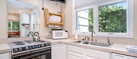 Dishwasher, coffee/tea maker, cookware/dishes/utensils