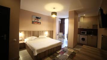 Chambre Double Deluxe, 1 trÚs grand lit | Coin séjour