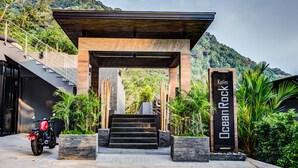 A modern building entrance with a sign reading "Ocean Rock." - Ocean Rock Kalim (Patong)