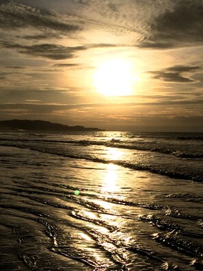On the beach, sun-loungers
