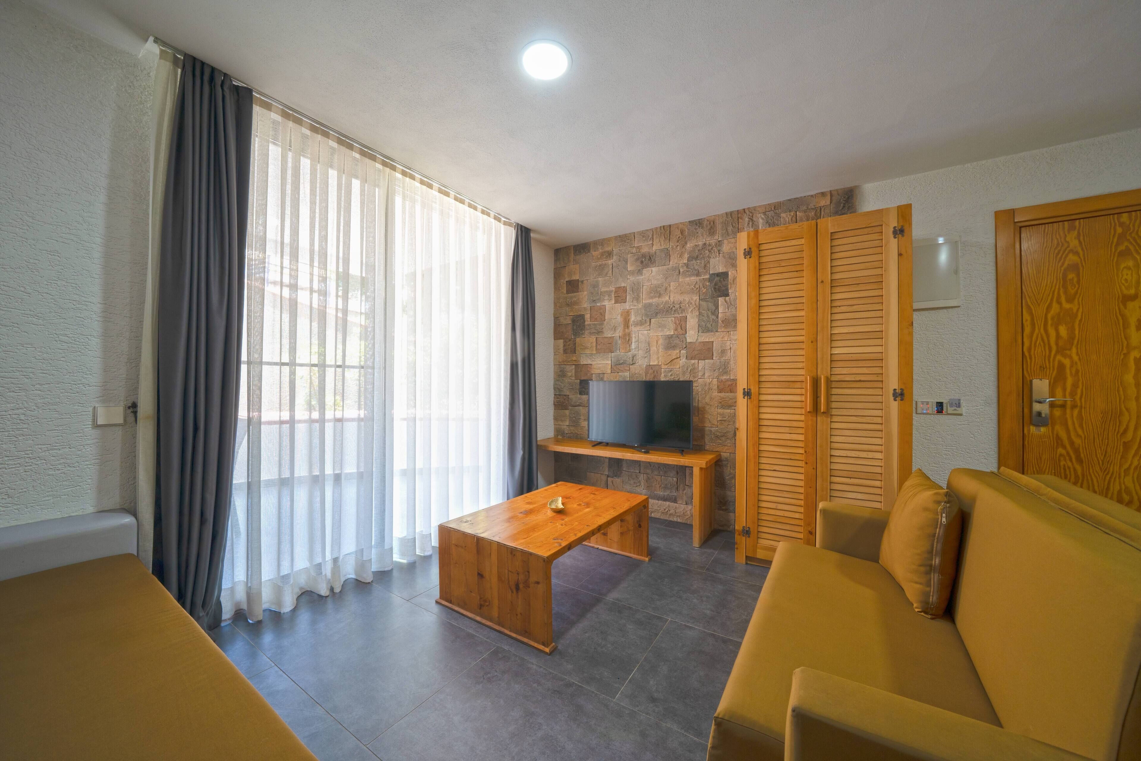 family quadruple room, balcony, garden view | 1 bedroom, minibar, in-room safe, desk