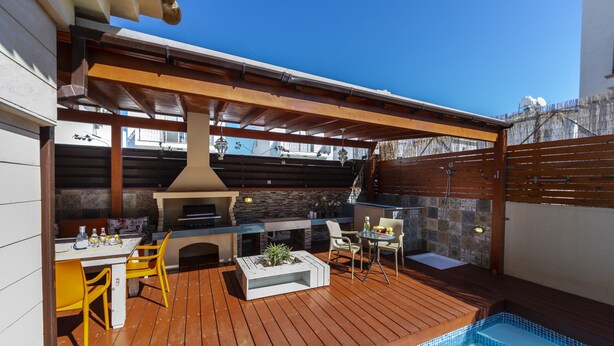 A patio with a barbecue, outdoor seating, and a small pool. - Protaras Villa Rocco Near The Beach (Protaras)
