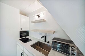 Microwave, stovetop, coffee/tea maker, toaster