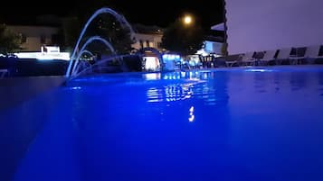 Seasonal outdoor pool, open 8:30 AM to 7:00 PM, pool loungers