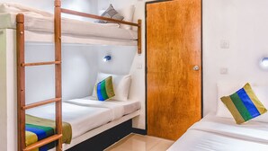 A bunk bed room with a wooden ladder, a door, and a single bed with a pillow. - Pinnawala Backpack Residencies (Rambukkana)