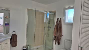 Shower, hair dryer, towels, soap