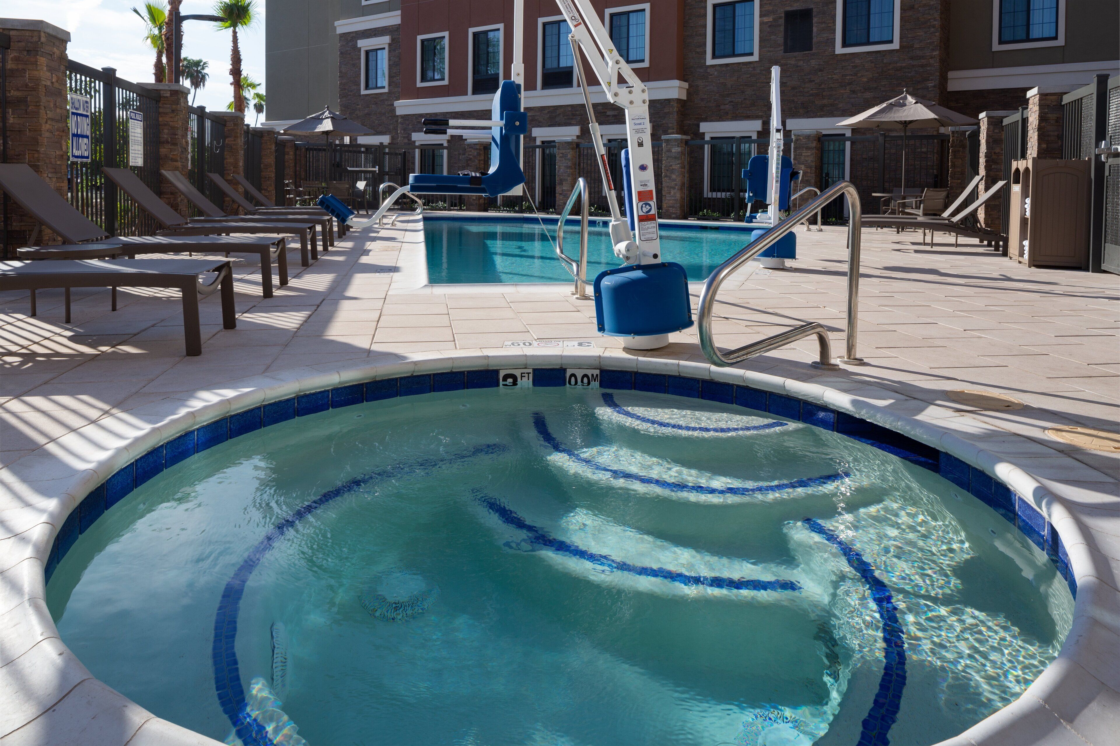 outdoor pool, open 8:00 am to 10:00 pm, pool umbrellas, pool loungers