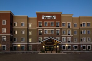 A multi-story hotel with a prominent Staybridge Suites sign. - Staybridge Suites Phoenix - Biltmore Area by IHG (Phoenix)