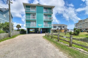 A multi-story building with a sign reading "DUNES I".
