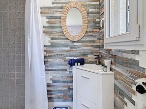 Combined shower/tub, hair dryer, towels, toilet paper