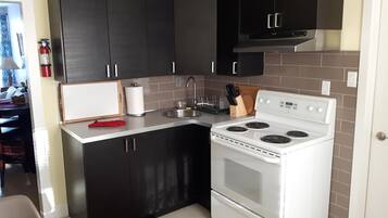 Fridge, microwave, stovetop, coffee/tea maker