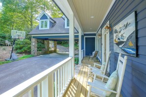 A covered porch with a basketball hoop, stone pillars, and a painting of birds. - Boone Home w/ Fire Pit - Near App Ski & Sugar Mtn! (Boone)