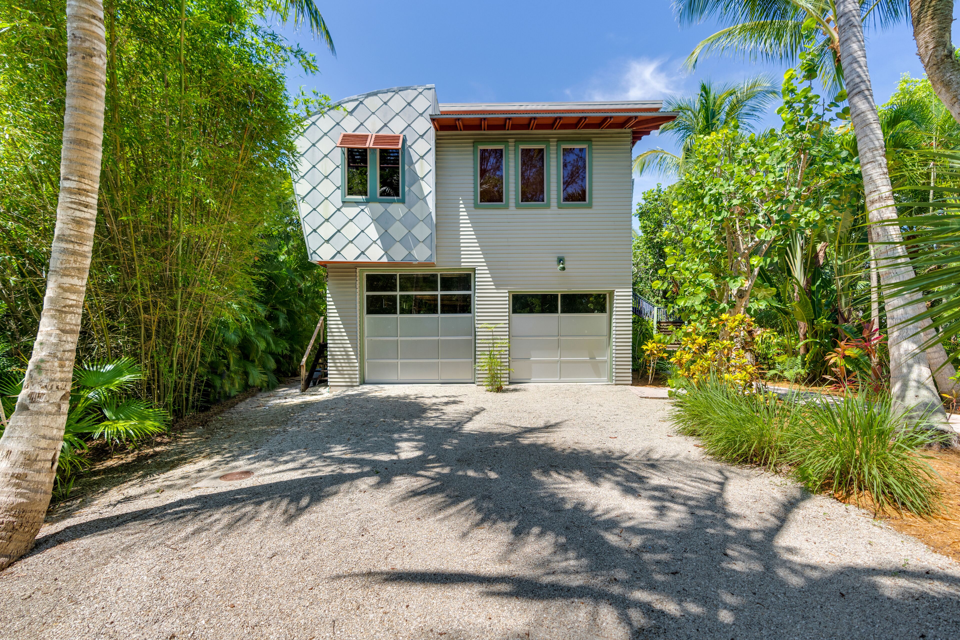 Architecturally stunning, home with the feel of a Balinese resort.  Ready for guests post Ian