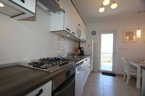 Fridge, coffee/tea maker, cookware/dishes/utensils, dining tables - Apartment Skvicalo (93974-A1) (Silo - island Krk)