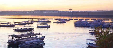 A marina with multiple boats docked at the pier.
