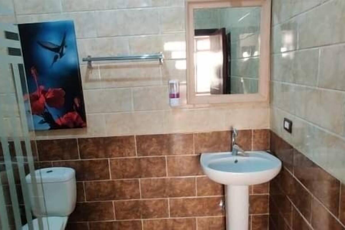 shower, rainfall showerhead, hair dryer, towels