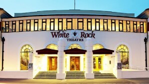 The exterior of the White Rock Theatre with its classic architecture, including arched windows and a central entrance. - Apollo Guest House (Hastings)