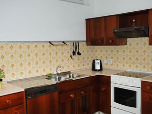 Fridge, oven, highchair, cookware/dishes/utensils