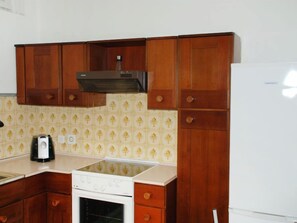 Fridge, oven, high chair, cookware/dishes/utensils