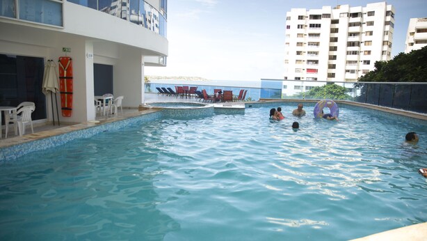 An indoor swimming pool with a view of a cityscape. - EDIFICIO POSIEDON located in the exclusive area of Laugito (Cartagena)