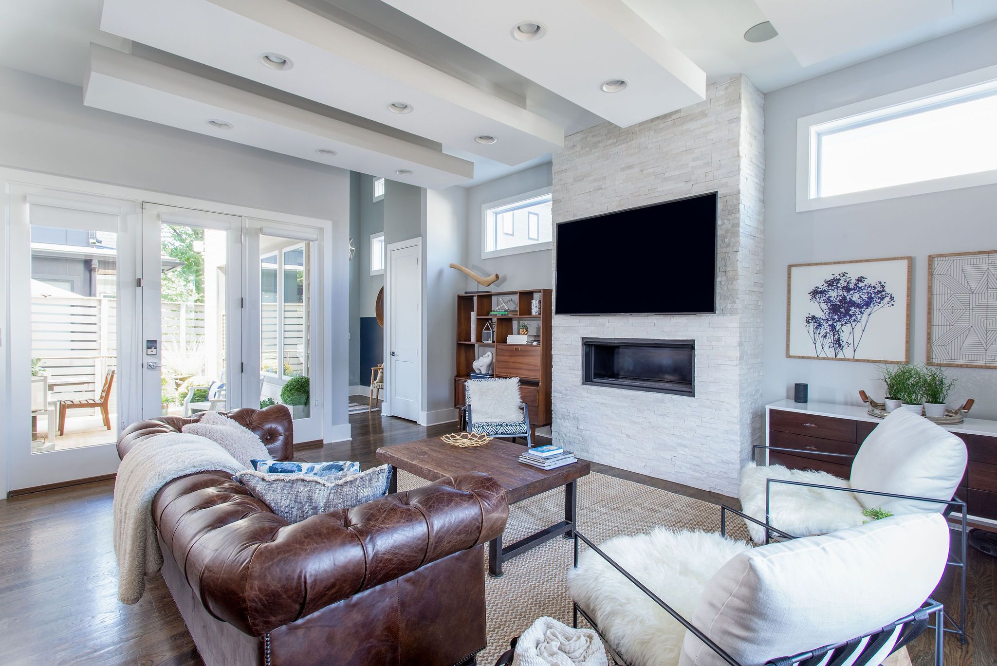 Smart TV, fireplace, books, printers