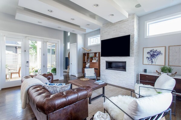 Smart TV, fireplace, books, printers